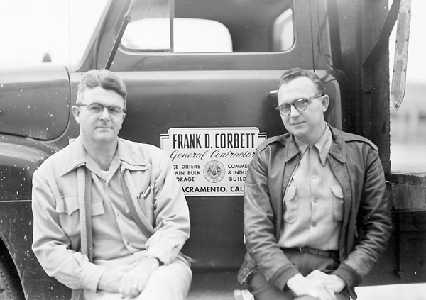 Frank D. Corbett.  General Contractor and founder of Television Education, Inc. sitting in front of his work truck.